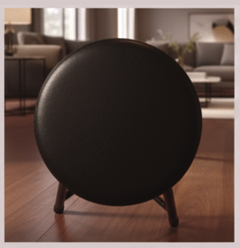 Black stool with a round seat and four legs.