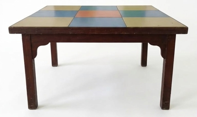 Montessori table with colorful square top and wooden legs
